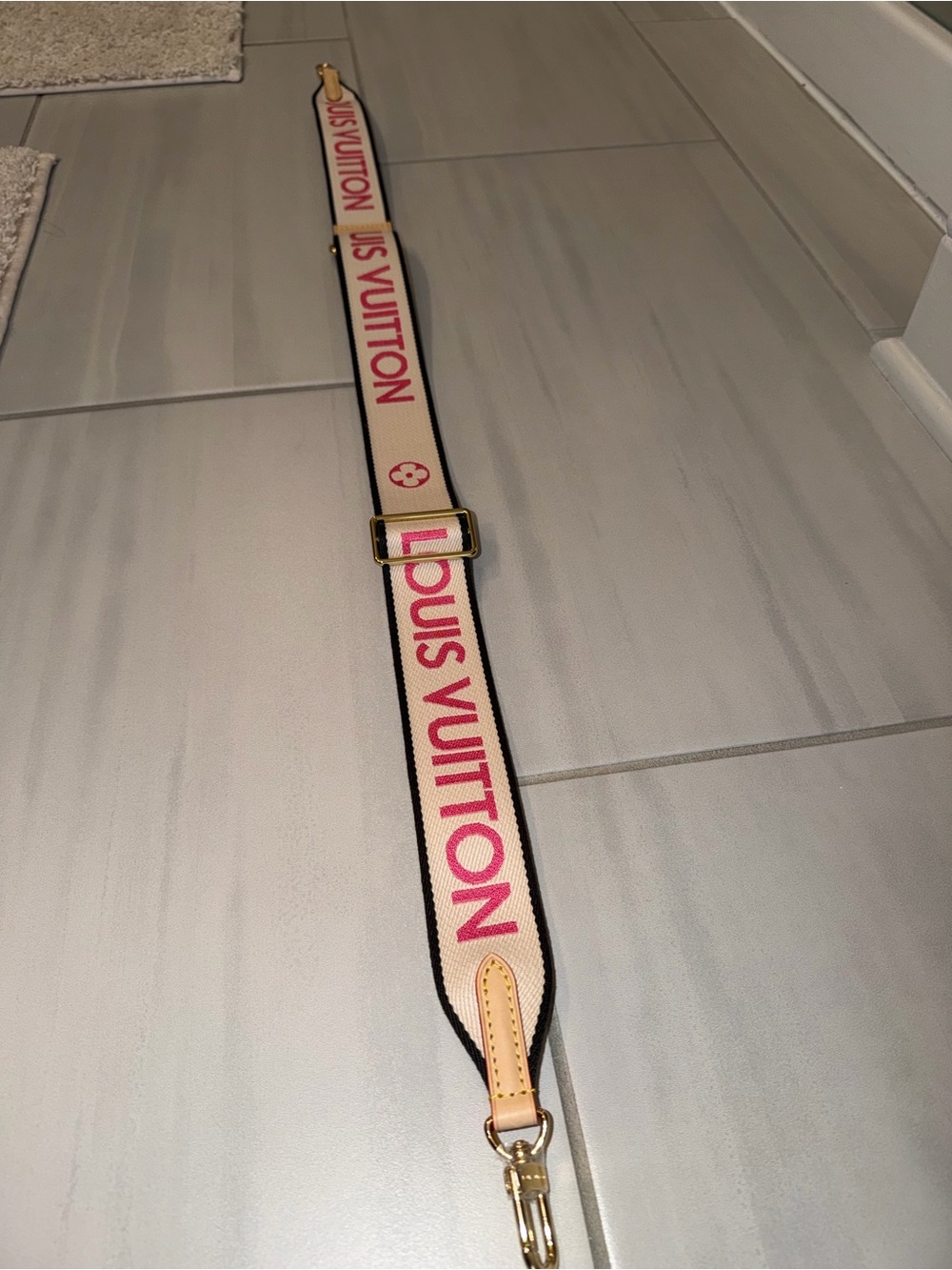 Louis Vuitton Cream Strap with Pink Logo and Gold Hardware
